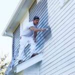 a man painting the exterior